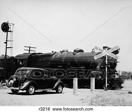 Stock Photo - 1930S Car Stopped At Railroad Crossing With Freight Train Speeding By . Fotosearch