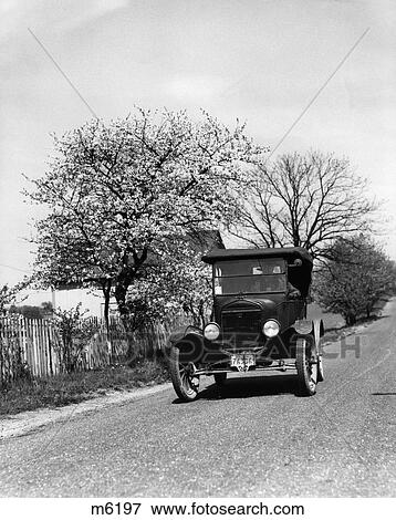 1930S Car Traveling Down Rural Road View Large Photo Image Stock Photo - 1930S Car Traveling Down Rural Road . Fotosearch