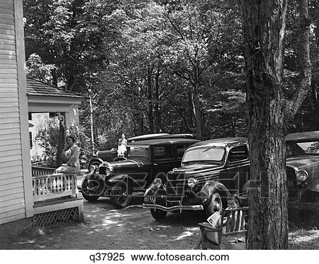 1930S Cars Parked Front Yard Woman On Porch Bench Lazy Summer Resort Cabin Cottage New Hampshire View Large Photo Image Stock Photography - 1930S Cars Parked Front Yard Woman On Porch Bench Lazy Summer Resort Cabin Cottage New Hampshire. Fotosearch