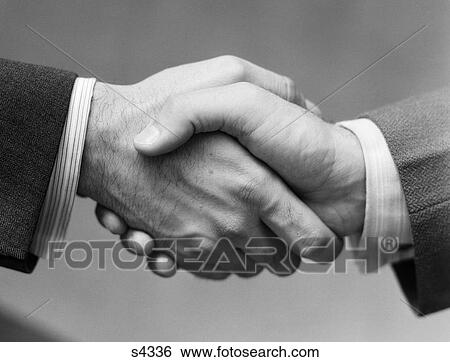 1930S Close-Up Of Businessmen'S Hands In Handshake Against Light Background View Large Photo Image Stock Photograph - 1930S Close-Up Of Businessmen'S Hands In Handshake Against Light Background . Fotosearch