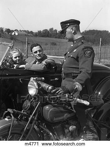 1930S Couple In Convertible Coupe Stopped By Motorcycle Cop Checking License Of Driver View Large Photo Image Stock Image - 1930S Couple In Convertible Coupe Stopped By Motorcycle Cop Checking License Of Driver . Fotosearch