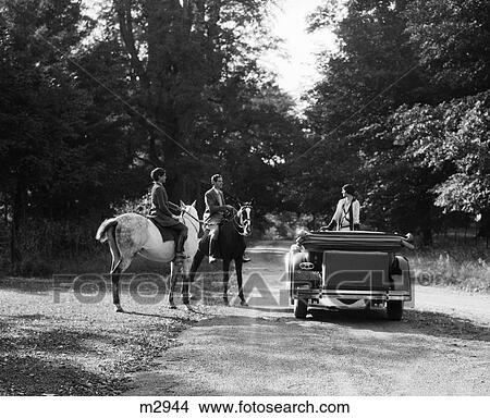 1930S Couple On Horses Meeting Woman On Road In Convertible View Large Photo Image Picture - 1930S Couple On Horses Meeting Woman On Road In Convertible . Fotosearch