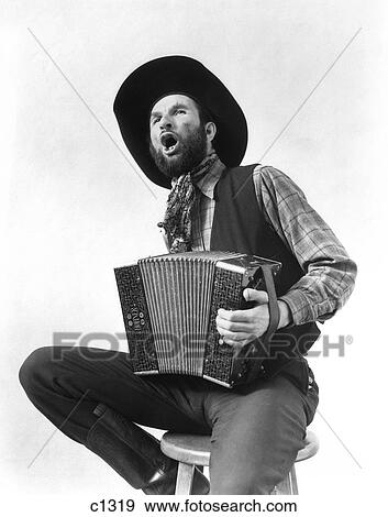 1930S Cowboy Playing Accordion & Singing View Large Photo Image Stock Photo - 1930S Cowboy Playing Accordion & Singing . Fotosearch