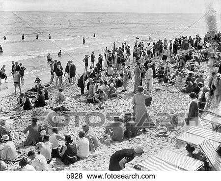 1930S Crowd Of People Some Clothed Others In Bathing Suits On Palm Beach In Florida View Large Photo Image Stock Photo - 1930S Crowd Of People Some Clothed Others In Bathing Suits On Palm Beach In Florida . Fotosearch