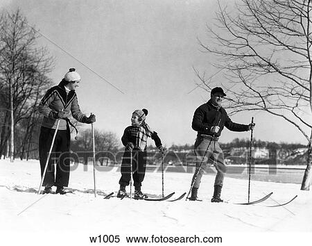 Stock Photography - 1930S Family Of Three Cross Country Skiing Mother Father Daughter . Fotosearch
