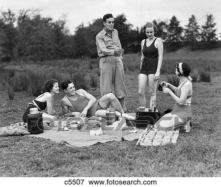 1930S Group Of Five Men & Women Having Picnic In Woods All But One In Swimsuits View Large Photo Image Stock Photo - 1930S Group Of Five Men & Women Having Picnic In Woods All But One In Swimsuits . Fotosearch