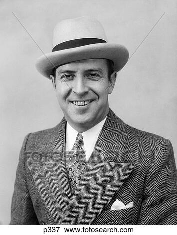 1930S Head & Shoulder Portrait Of Smiling Man In Herringbone Suit Paisley Tie & White Hat View Large Photo Image Stock Photo - 1930S Head & Shoulder Portrait Of Smiling Man In Herringbone Suit Paisley Tie & White Hat . Fotosearch