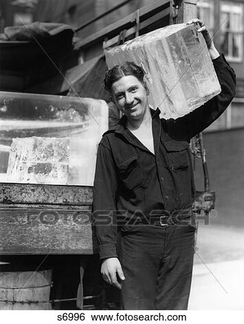 1930S Ice Delivery Man Carrying Large Block Of Ice On Shoulder View Large Photo Image Stock Photograph - 1930S Ice Delivery Man Carrying Large Block Of Ice On Shoulder . Fotosearch