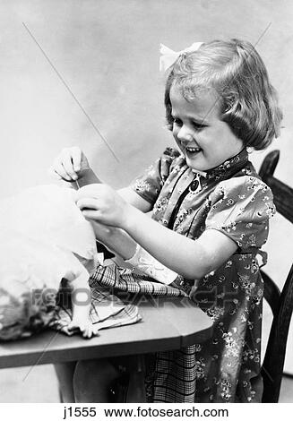 1930S Little Girl In Print Dress Smiling Sew Dress For Doll Toy Lying On Table Needle Thread View Large Photo Image Stock Photography - 1930S Little Girl In Print Dress Smiling Sew Dress For Doll Toy Lying On Table Needle Thread . Fotosearch