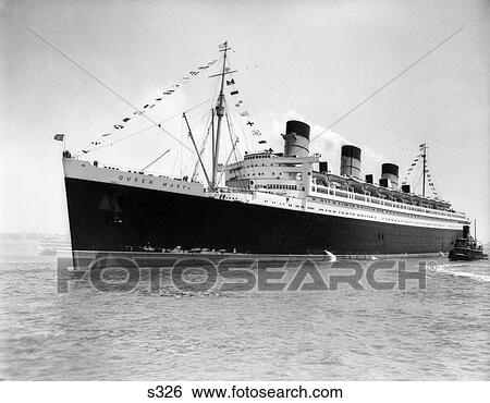 Stock Photograph - 1930S Maiden Voyage Of Queen Mary Dwarfing Small Tugboat Moving Alongside It . Fotosearch