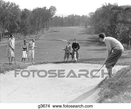 1930S Man In Knickers Golfing In Sandtrap With Men & Women Looking On View Large Photo Image Picture - 1930S Man In Knickers Golfing In Sandtrap With Men & Women Looking On . Fotosearch