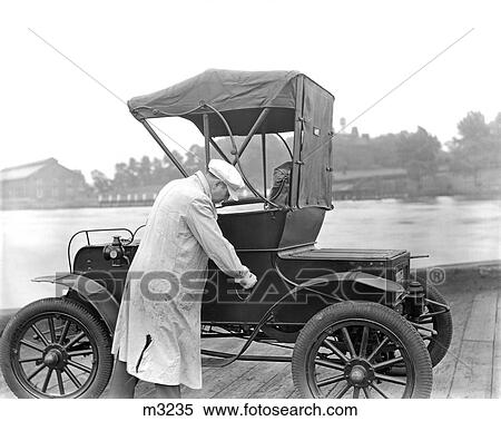1930S Mechanic In White Smock Checking Early Reo View Large Photo Image Stock Photography - 1930S Mechanic In White Smock Checking Early Reo . Fotosearch