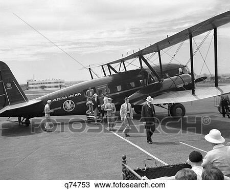 Stock Image - 1930S Newark Nj Airport American Airlines Condor Plane With Disembarking Passengers . Fotosearch