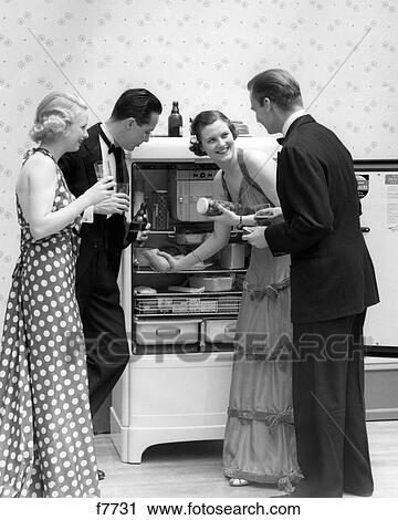 1930S Pair Of Couples In Formal Dress Raiding The Refrigerator View Large Photo Image Stock Image - 1930S Pair Of Couples In Formal Dress Raiding The Refrigerator . Fotosearch