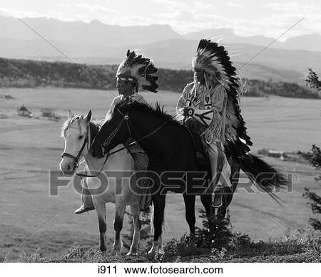 1930S Pair Of Sioux Indians Wearing Headdresses On Horseback View Large Photo Image Stock Image - 1930S Pair Of Sioux Indians Wearing Headdresses On Horseback . Fotosearch