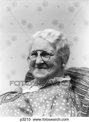 1930S Portrait Of Elderly Woman Smiling Wearing Granny Glasses View Large Photo Image Stock Photography - 1930S Portrait Of Elderly Woman Smiling Wearing Granny Glasses . Fotosearch