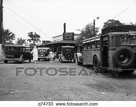 Stock Image - 1930S Roadside Diner Restaurant Bus Stop Woman Girl In Parking Loat Cars Chicken 40 Cents Croton New York July 5 1937. Fotosearch