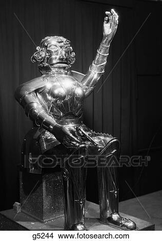 1930S Robot Man Manufactured From Metal Sitting Holding A Gun In Its Hand Futuristic View Large Photo Image Picture - 1930S Robot Man Manufactured From Metal Sitting Holding A Gun In Its Hand Futuristic . Fotosearch