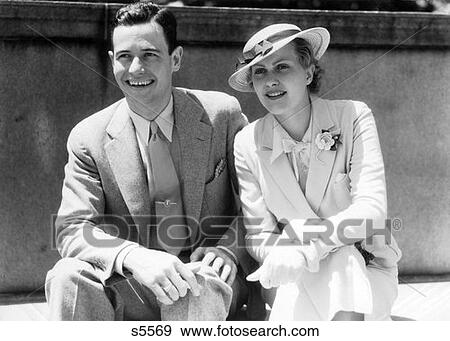 1930S Smiling Couple Sitting Outdoors In The Sunlight View Large Photo Image Stock Photo - 1930S Smiling Couple Sitting Outdoors In The Sunlight. Fotosearch
