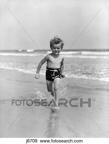 1930S Smiling Little Toddler Running In Surf View Large Photo Image Stock Photo - 1930S Smiling Little Toddler Running In Surf. Fotosearch