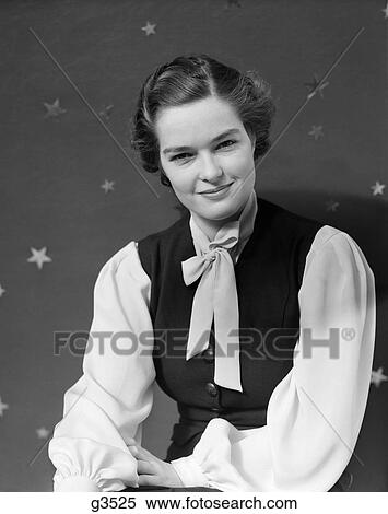 1930S Woman Portrait Smiling Towards Camera Star Printed Backdrop Wearing Vest Bow Collar View Large Photo Image Stock Photography - 1930S Woman Portrait Smiling Towards Camera Star Printed Backdrop Wearing Vest Bow Collar . Fotosearch