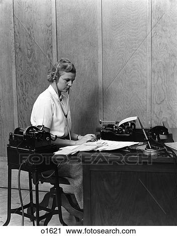 1930S Woman Secretary At Business Office Deck Transcribing From Dictaphone Dictation Voice Recording Machine View Large Photo Image Stock Image - 1930S Woman Secretary At Business Office Deck Transcribing From Dictaphone Dictation Voice Recording Machine . Fotosearch