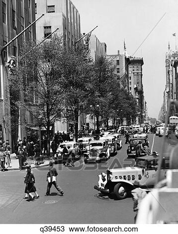1939 1930S Retro Rockefeller Center Automobile Pedestrian Fifth Avenue Trees Leaf Street View Large Photo Image Stock Image - 1939 1930S Retro Rockefeller Center Automobile Pedestrian Fifth Avenue Trees Leaf Street. Fotosearch