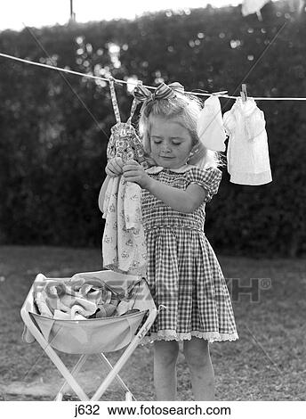 1940 1940S 1950 1950S Girl Gingham Dress Hanging Doll Laundry Clothes On Line Clothesline Playing Future Homemaker Role Playing View Large Photo Image Stock Image - 1940 1940S 1950 1950S Girl Gingham Dress Hanging Doll Laundry Clothes On Line Clothesline Playing Future Homemaker Role Playing. Fotosearch