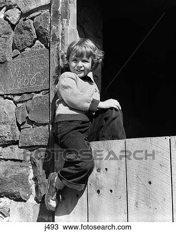 1940 1940S 1950 1950S Smiling Girl Wear Sweater Trousers Sitting Wooden Door Stone Barn Built In 1806 Farm Retro View Large Photo Image Stock Image - 1940 1940S 1950 1950S Smiling Girl Wear Sweater Trousers Sitting Wooden Door Stone Barn Built In 1806 Farm Retro . Fotosearch