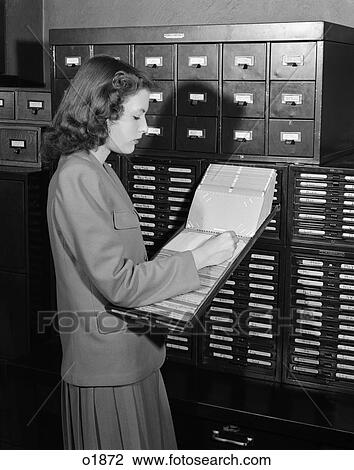 1940 1940S 1950 1950S Woman In Office Standing Near Filing Cabinets View Large Photo Image Stock Image - 1940 1940S 1950 1950S Woman In Office Standing Near Filing Cabinets . Fotosearch