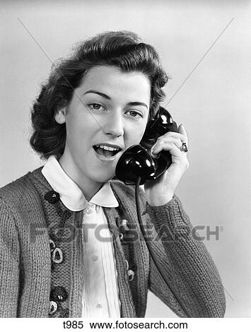 Stock Photography - 1940 1940S 1950 1950S Young Woman Talking On Telephone . Fotosearch