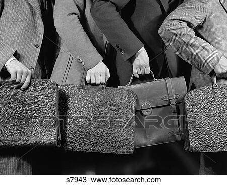 1940 1940S Business Men Holding Briefcases View Large Photo Image Stock Image - 1940 1940S Business Men Holding Briefcases . Fotosearch