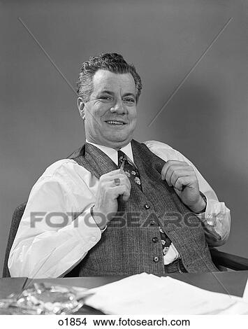 1940 1940S Man In Suit Sitting At Desk Smiling View Large Photo Image Picture - 1940 1940S Man In Suit Sitting At Desk Smiling . Fotosearch