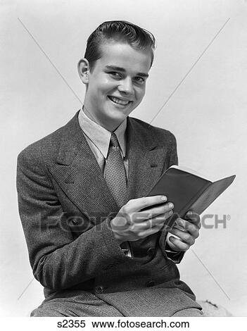 1940 1940S Man In Suit Smiling Holding Book View Large Photo Image Stock Photography - 1940 1940S Man In Suit Smiling Holding Book . Fotosearch