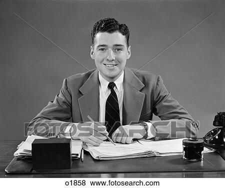 1940 1940S Man Sitting At Desk In Office View Large Photo Image Stock Photo - 1940 1940S Man Sitting At Desk In Office . Fotosearch