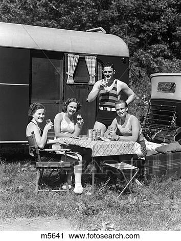 1940 1940S Men Women Couples Camping Trailer Picnic Vacation Lunch View Large Photo Image Stock Image - 1940 1940S Men Women Couples Camping Trailer Picnic Vacation Lunch . Fotosearch