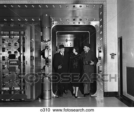 1940 1940S Retro Bank Vault Customer Finance Money Safe Men Woman Stole Hat Suit View Large Photo Image Stock Image - 1940 1940S Retro Bank Vault Customer Finance Money Safe Men Woman Stole Hat Suit . Fotosearch