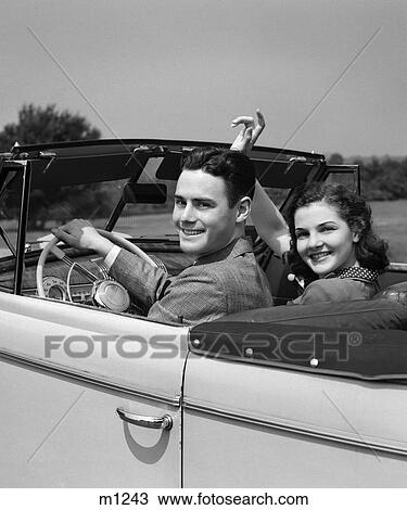 Stock Image - 1940 1940S Retro Couple Car Driving Smile Convertible Date Wave . Fotosearch
