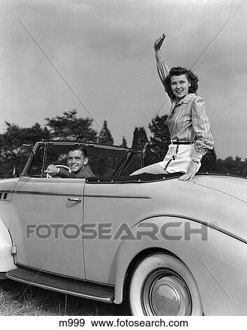 1940 1940S Retro Couple Car Driving Convertible Smile Waving View Large Photo Image Stock Photo - 1940 1940S Retro Couple Car Driving Convertible Smile Waving . Fotosearch
