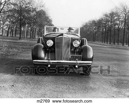 1940 1940S Retro Couple Driving Car Convertible View Large Photo Image Stock Photo - 1940 1940S Retro Couple Driving Car Convertible. Fotosearch