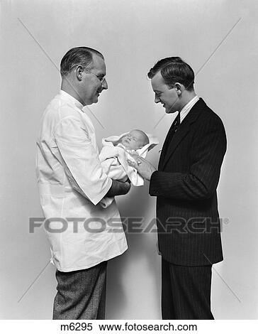 1940 1940S Retro Doctor Father Infant Baby Proud View Large Photo Image Stock Photography - 1940 1940S Retro Doctor Father Infant Baby Proud . Fotosearch