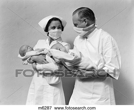 1940 1940S Retro Doctor Nurse Babies Infants Newborns Masks Twins View Large Photo Image Stock Photo - 1940 1940S Retro Doctor Nurse Babies Infants Newborns Masks Twins . Fotosearch