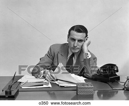 1940 1940S Retro Man Tires Overworked Desl Telephone Leaning Paperwork View Large Photo Image Stock Image - 1940 1940S Retro Man Tires Overworked Desl Telephone Leaning Paperwork . Fotosearch
