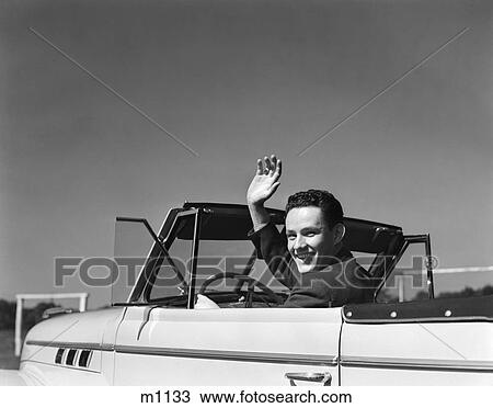 Stock Image - 1940 1940S Retro Man Waving Car Ride Convertible Smile . Fotosearch
