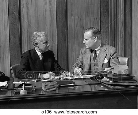 1940 1940S Retro Men Desk Paperwork Meeting Suit Hat Business View Large Photo Image Stock Photograph - 1940 1940S Retro Men Desk Paperwork Meeting Suit Hat Business . Fotosearch