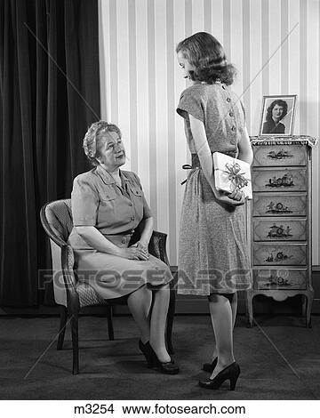 1940 1940S Retro Mother And Daughter Present Package Gift View Large Photo Image Picture - 1940 1940S Retro Mother And Daughter Present Package Gift . Fotosearch