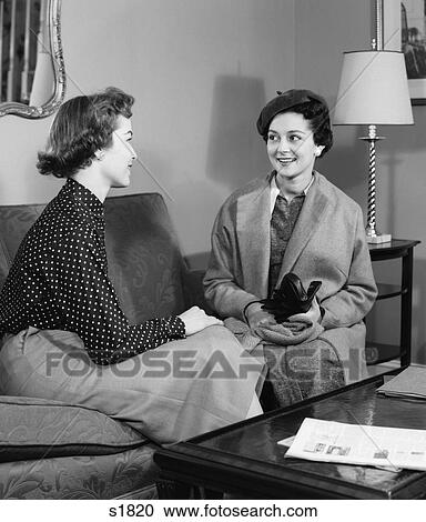 1940 1940S Two Women Sitting On Couch In Living Room Talking View Large Photo Image Stock Image - 1940 1940S Two Women Sitting On Couch In Living Room Talking . Fotosearch