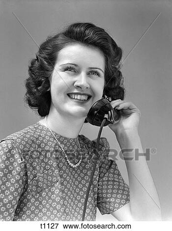 1940 1940S Woman Talking On Telephone View Large Photo Image Stock Photo - 1940 1940S Woman Talking On Telephone . Fotosearch