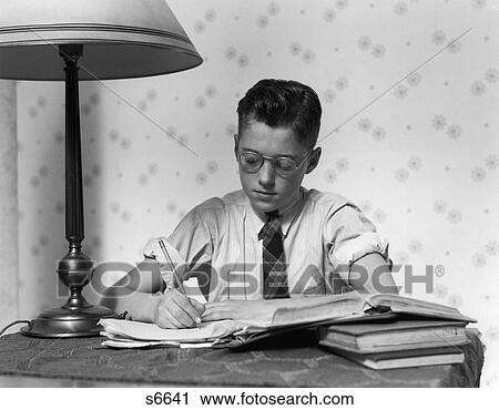1940 1940S Young Boy Wearing Glasses Studying Writing View Large Photo Image Stock Image - 1940 1940S Young Boy Wearing Glasses Studying Writing . Fotosearch