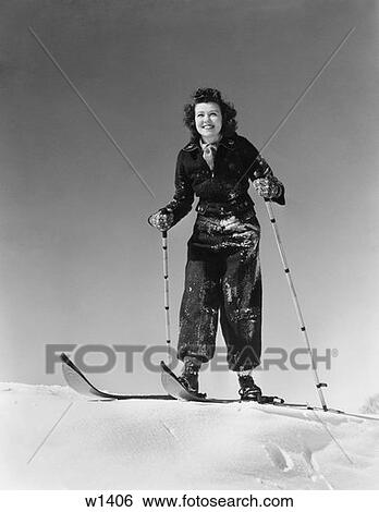 1940S 1930S Woman Smiling Standing On Skis Holding Ski Poles View Large Photo Image Stock Photograph - 1940S 1930S Woman Smiling Standing On Skis Holding Ski Poles. Fotosearch